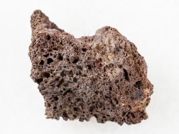 macro shooting of natural mineral rock specimen - rough Pumice of basic composition stone on white marble background