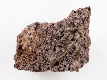 macro shooting of natural mineral rock specimen - raw Pumice of basic composition stone on white marble background