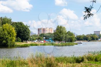 urban recreation area on Large Garden (Academichesky) Pond in Timiryazevskiy park of Moscow city on summer day