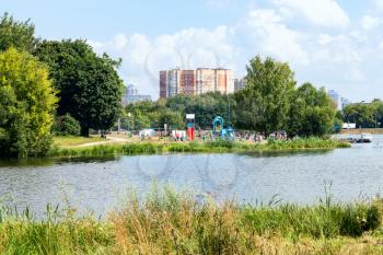 urban recreation area on Large Garden (Big Academic) Pond in Timiryazevskiy park of Moscow city on summer day