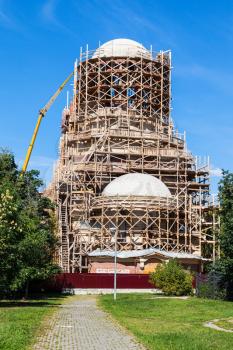 construction of tower of orthodox temple of Saint Spyridon (St Spiridon) Bishop of Trimythous in Koptevo district of Moscow on sunny summer day