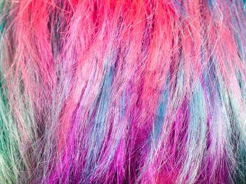 colorful dyed strands of female hairs close up