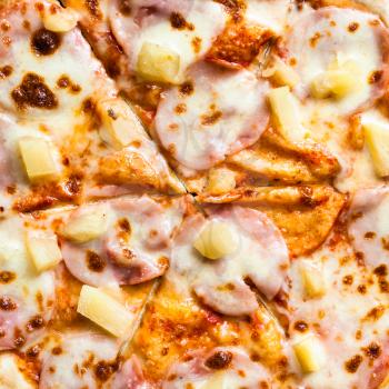 filling of Hawaiian pizza with ham and pineapple close up