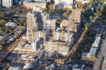 aerial view of construction site of high-rise house in residential district of Moscow city in autumn day