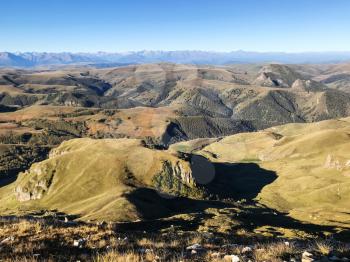 travel to North Caucasus region region - view of Caucasus mountains from Bermamyt Plateau at autumn morning