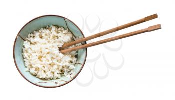 top view of chopsticks in bowl with boiled rice isolated on white background