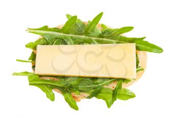 top view of open sandwich with fresh bread, cheese and green arugula leaves isolated on white background