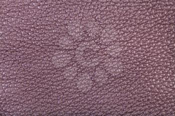 textured background from purple brown leather close up