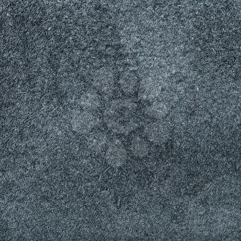 textured square background from dark gray suede close up