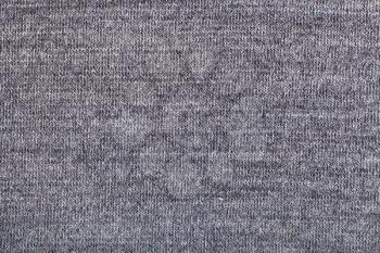 textile background - woven yarns in gray wool jersey knitted fabric close up