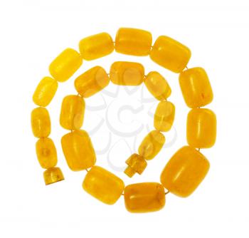 top view of spiral vintage necklace from yellow melted amber isolated on white background