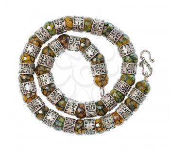 top view of antique arabic spiral necklace from faceted Jadeite gems and silver rings isolated on white background
