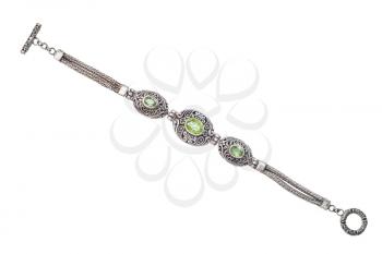 top view of traditional vintage indian silver bracelet with natural green peridot gemstones isolated on white background