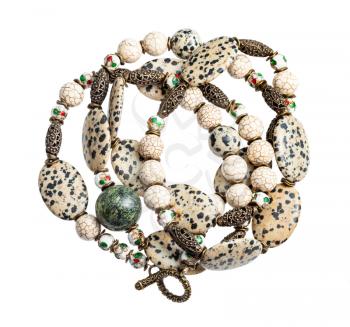tangled handcrafted necklace from aplite cabochons, glass beads, green serpentinite ball, cracked cacholong beads and brass inserts isolated on white background