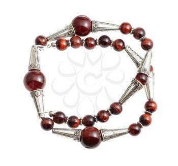 handcrafted necklace from brown agate and ox's eye beads and silver inserts isolated on white background