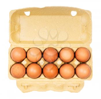top view of ten brown chicken eggs (nine brown eggs and one white) in yellow paper box isolated on white background