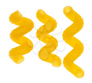three single dried Cavatappi (variety of italian short pasta) close up isolated on white background