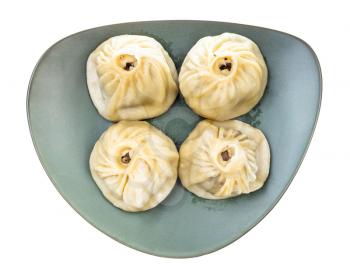 top view of steamed Buuz (Mongolian dumpling filled with minced meat) on green plate isolated on white background