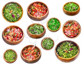 set of various vegetable salads in wooden bowls isolated on white background
