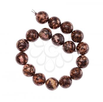 top view of coiled string of beads from natural polished rhodonite gemstone isolated on white background
