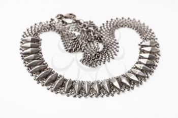 tangled antique silver woven necklace in Art Nouveau style on white paper background