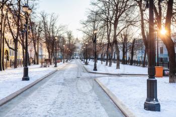 sunrise over snow-covered Petrovsky Boulevard in Moscow city in sunny winter morning