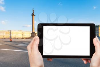 travel concept - tourist photographs of Palace Square with Alexander Column in Saint Petersburg city in March on smartphone with empty cutout screen with blank place for advertising