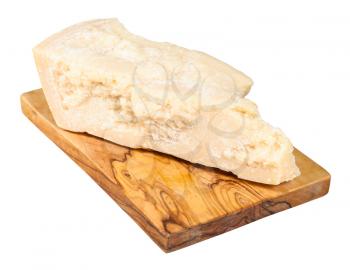 piece of local italian Parmigiano Reggiano (Parmesan) hard cheese on olive wood cutting board isolated on white background