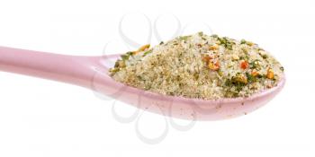 side view of ceramic spoon with seasoned salt with dried vegetables and flavours close up isolated on white background