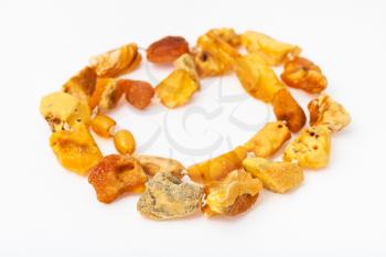 tangled necklace from natural raw yellow amber nuggets on white paper background