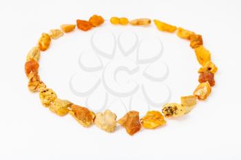 necklace from natural raw yellow amber nuggets on white paper background