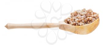 side view of buckwheat porridge in wooden spoon isolated on white background