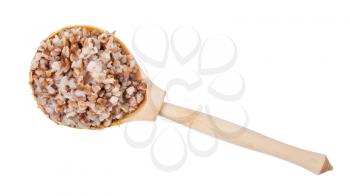 top view of buckwheat porridge in wooden spoon isolated on white background