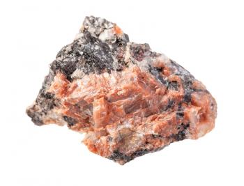 closeup of sample of natural mineral from geological collection - unpolished red Granite rock isolated on white background