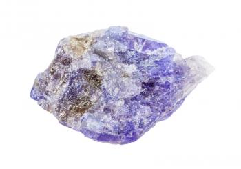 closeup of sample of natural mineral from geological collection - rough Tanzanite (blue violet zoisite) rock isolated on white background