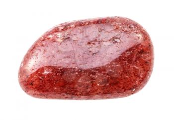 closeup of sample of natural mineral from geological collection - tumbled red Aventurine gem stone isolated on white background