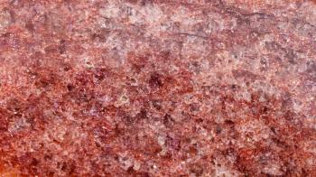 panoramic background from polished natural red brown Aventurine rock close up