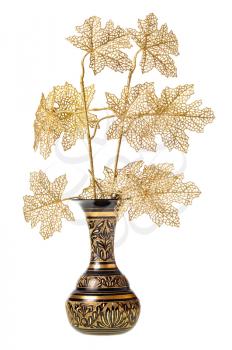 plastic twigs of tree in carved brass indian vase isolated on white background