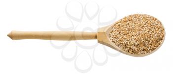 wooden spoon with uncooked wheat groats (crushed partly hulled wheat grains) isolated on white background