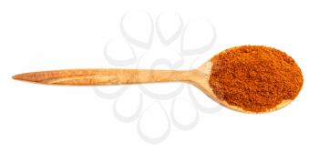 top view of wood spoon with chili powder from cayenne pepper isolated on white background