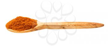 wooden spoon with chili powder from cayenne pepper isolated on white background