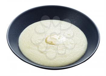 buttered semolina from durum wheat in gray bowl isolated on white background