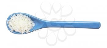 top view of coconut flakes in ceramic spoon isolated on white background