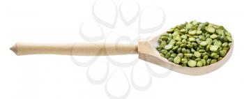 wooden spoon with green split peas isolated on white background