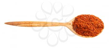 top view of wood spoon with paprika powder isolated on white background
