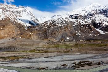 Spiti Valley - village and snowcapped Himalayan Mountains. Himachal Pradesh, India