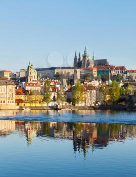 View of Charles bridge over Vltava river and Gradchany (Prague Castle) and St. Vitus Cathedral