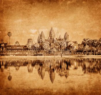 Vintage retro effect filtered hipster style weathered toned travel image of Cambodia landmark Angkor Wat with reflection in water