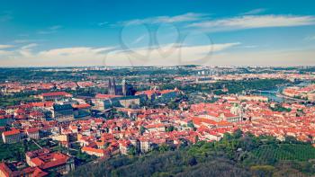 Vintage retro hipster style travel image of aerial panorama of Hradchany: the Saint Vitus (St. Vitt's) Cathedral and Prague Castle. Prague, Czech Republic