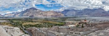 Panorama of Nubra valley in Himalayas with giant Buddha statue in Diskit, Ladakh, India